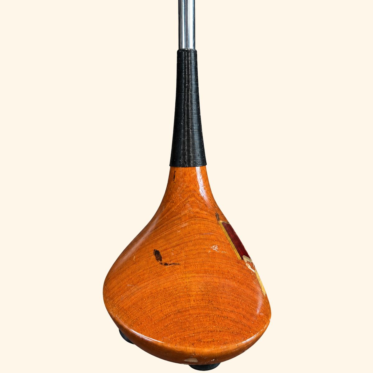 The Wilson Heritage club head crown on a cream background