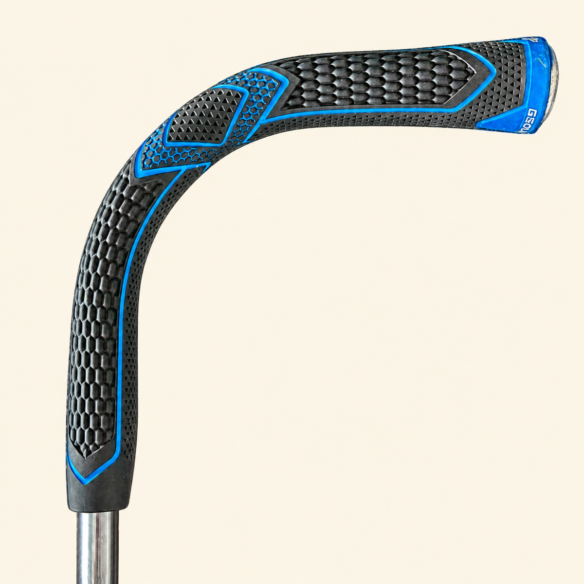 G Cane black and blue handle close-up on a cream background