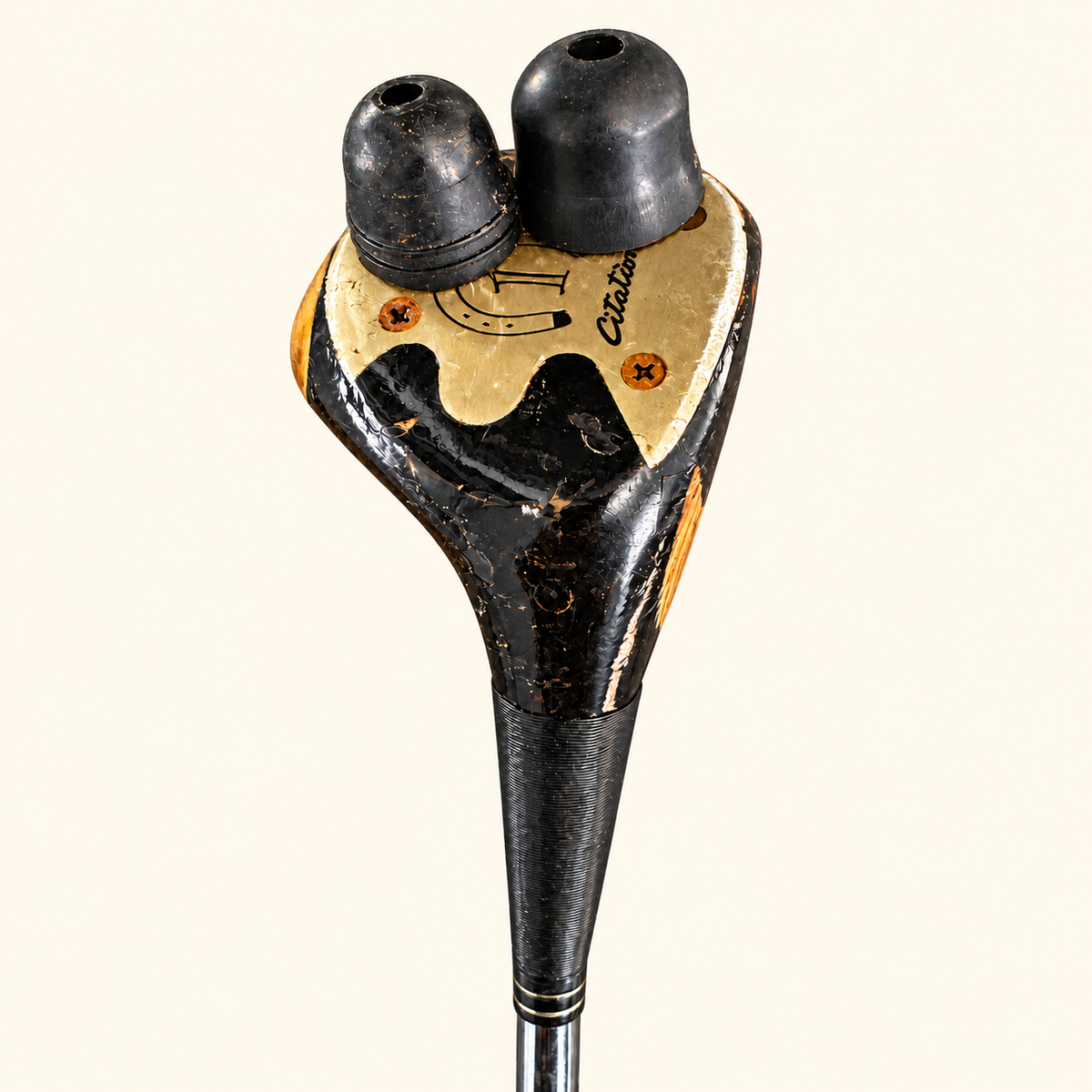Model 12 club head sole close-up on a cream background