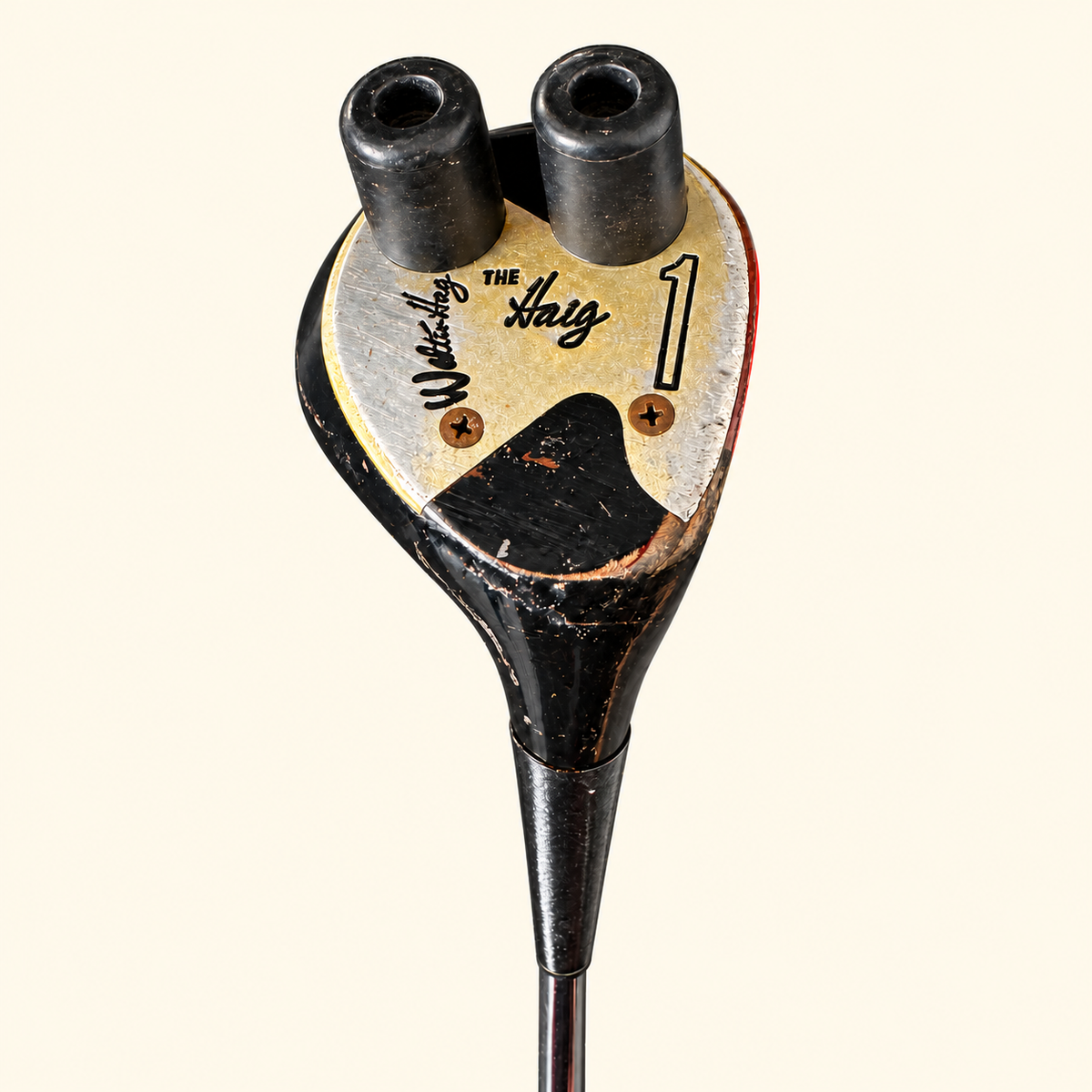 Model 25 club head sole close-up on a cream background